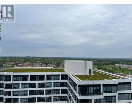 A modern building with the words "Dream Home Realty" on the side.