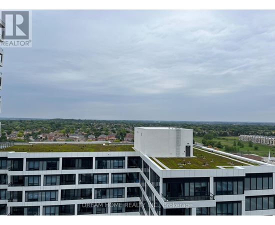 A modern building with the words "Dream Home Realty" on the side.