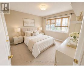 A bedroom with a large bed and a window with blinds.