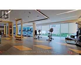 A gym with a variety of equipment including treadmills, stationary bikes, and weight machines.