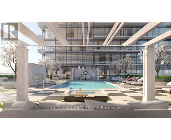 A modern building with a pool in the foreground and a sign that says "REALTOR".