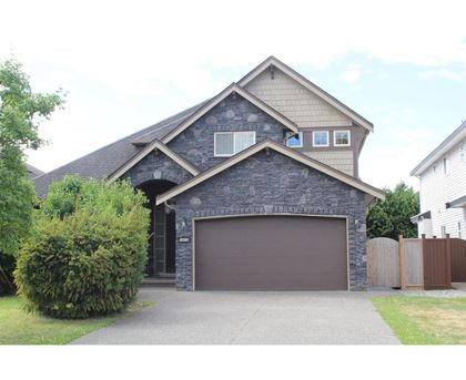 A house with a garage and a driveway.