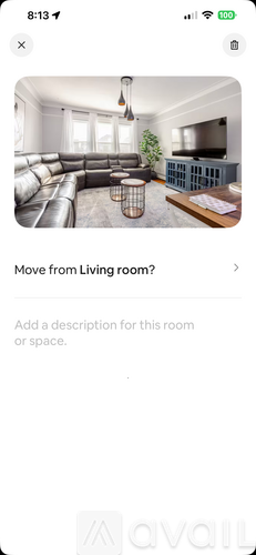 A living room with a grey sofa and a wooden coffee table.