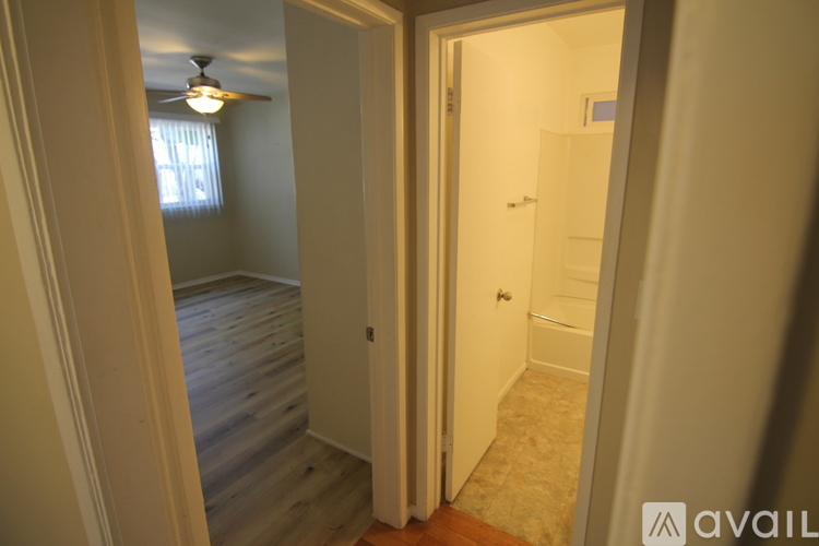 A room with a doorway leading to another room.