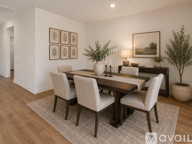 A dining room with a wooden table and chairs.