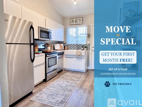 A kitchen with a refrigerator, microwave, and oven is on display for a move-in special.