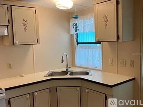 A kitchen with a sink and cabinets.