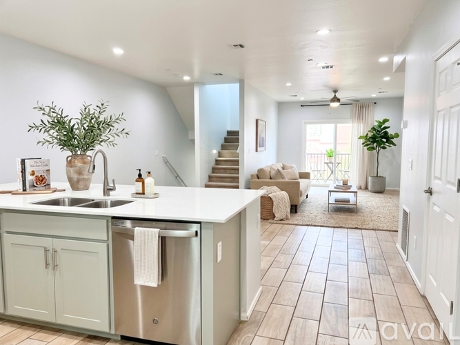 A kitchen with a dishwasher and sink.