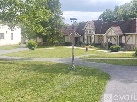 A house with a lawn in front of it.