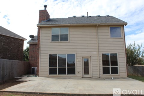 A house with a brown roof and a beige exterior is available for rent.