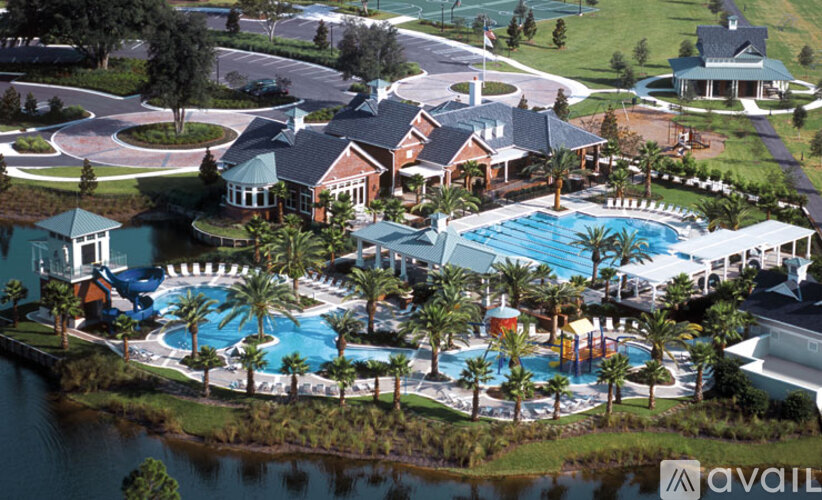 A large resort with a pool and a waterfall.