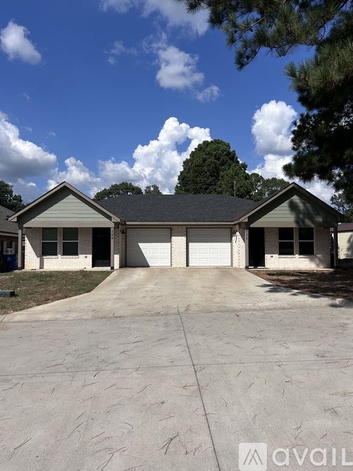 A house with a driveway in front of it.