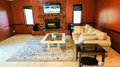 A living room with a fireplace and a couch.