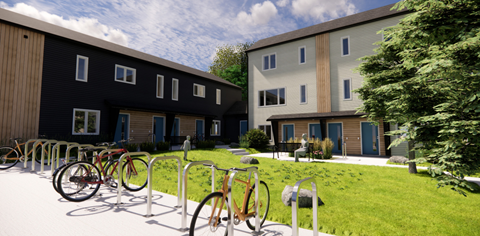 A bicycle parking area in front of a building.