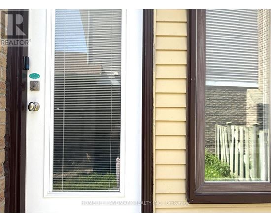 A white door with a window on the right side of the image.