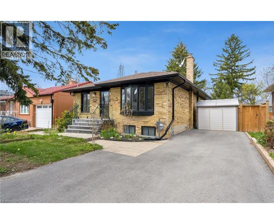 A house with a driveway in front of it.