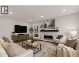 A living room with a fireplace, a television, and a coffee table.