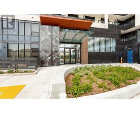 The front of a building with a glass door and a sign that says "REALTOR".