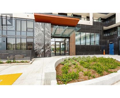 The front of a building with a glass door and a sign that says "REALTOR".