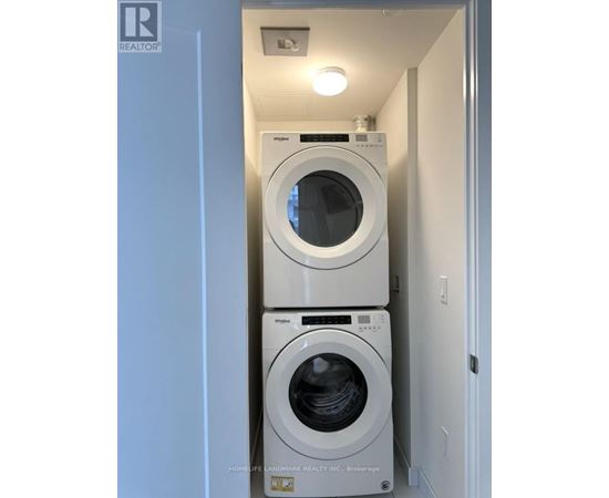A washer and dryer in a small laundry room.