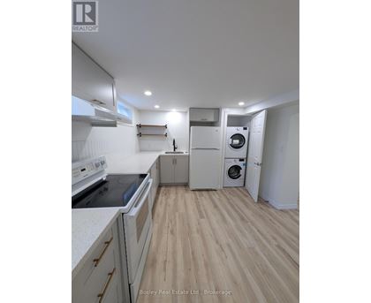 A kitchen with a stove top oven and a dishwasher.