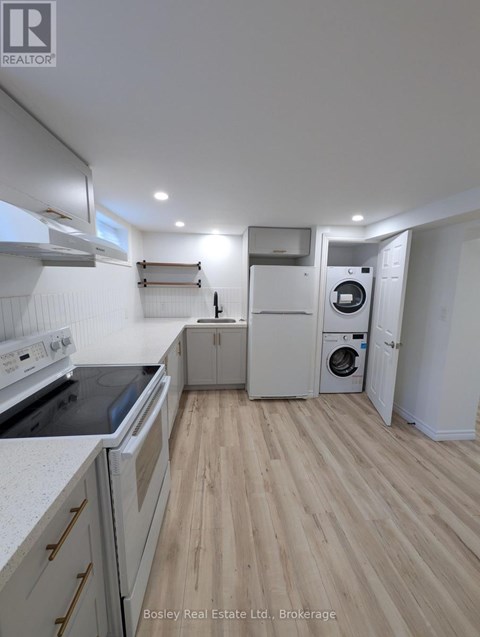 A kitchen with a stove top oven and a dishwasher.