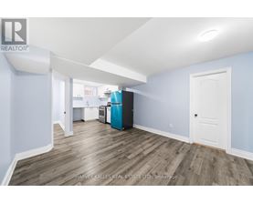 A room with a blue wall and a white door.