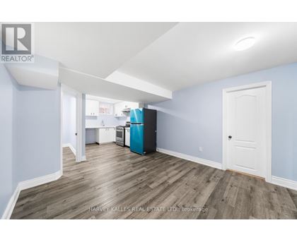 A room with a blue wall and a white door.