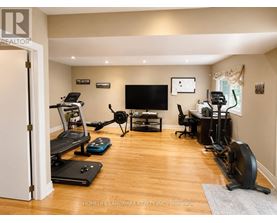 A spacious home gym with a variety of exercise equipment.