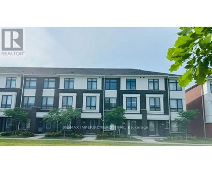A building with the sign REMAX IMPERIAL CREAL INC. in front of it.