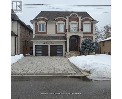 A brick house with a sign that says "Best Custom Craftsmen" in front of it.