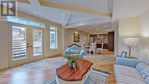 A living room with a wooden coffee table and a striped sofa.