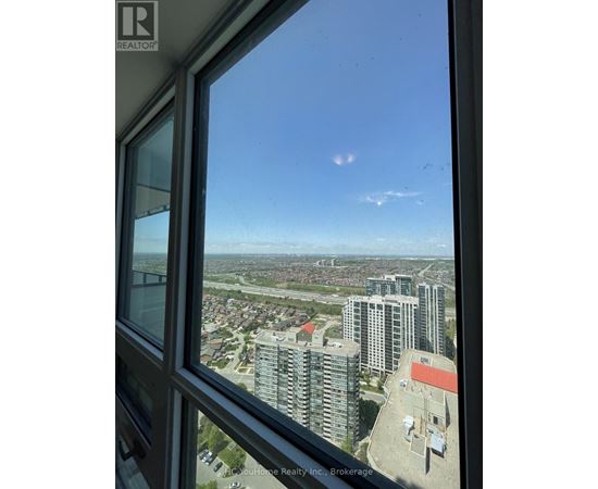 A view from a high-rise building looking out over a cityscape.
