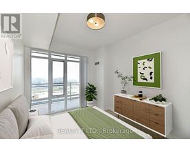 A well-lit, modern bedroom with a large window and a green cushion on the bed.