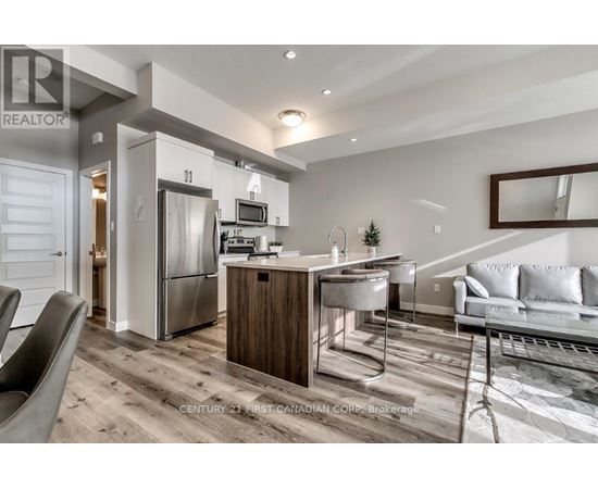 A modern kitchen with a dining table and chairs.