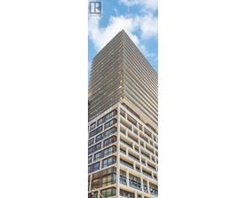 A tall building with many windows is shown in the image.