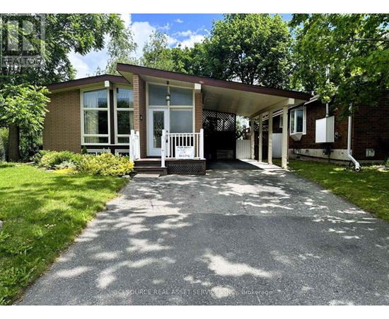 A house with a white picket fence in front.