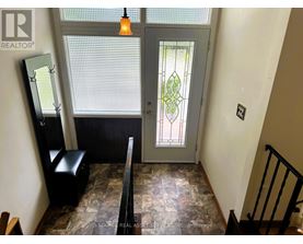 A stained glass door with a diamond pattern in the middle.