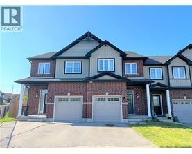 A large house with a garage is for sale.