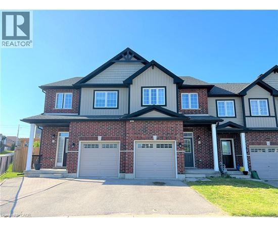 A large house with a garage is for sale.