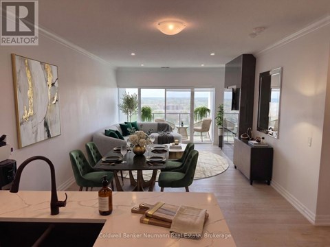 A dining room with a table set for two and a view of the city.