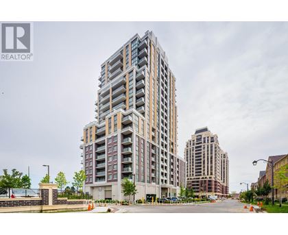 A tall residential building with a balcony on the 10th floor.