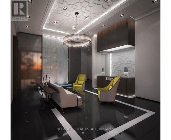 A modern waiting room with a glass table and yellow chairs.