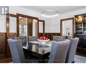A dining room with a table set for four.