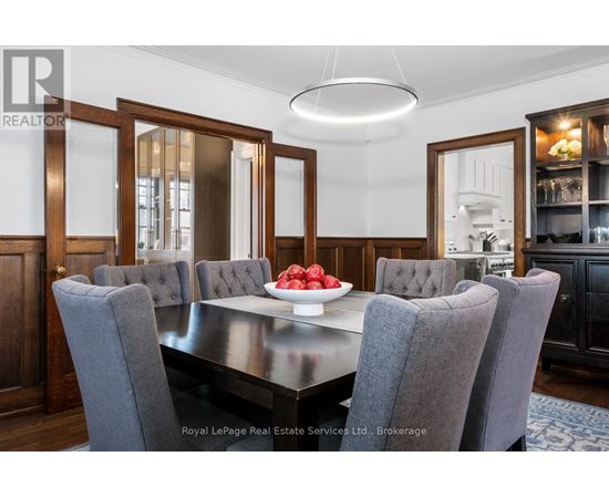 A dining room with a table set for four.