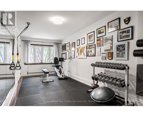 A well-equipped home gym with a variety of exercise equipment.