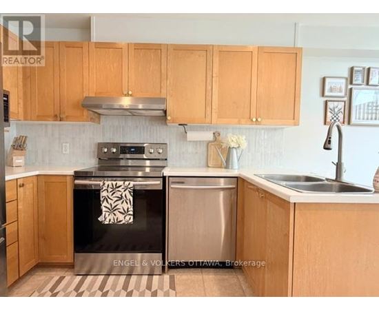 A kitchen with wooden cabinets and a black stove top oven.