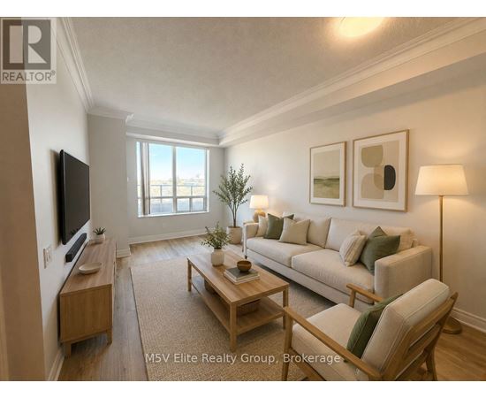 A living room with a couch, coffee table, and television.