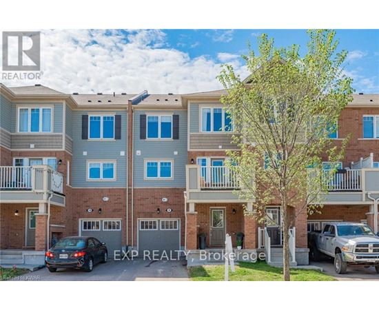 A real estate brokerage photo of a multi-story residential building with cars parked in front.