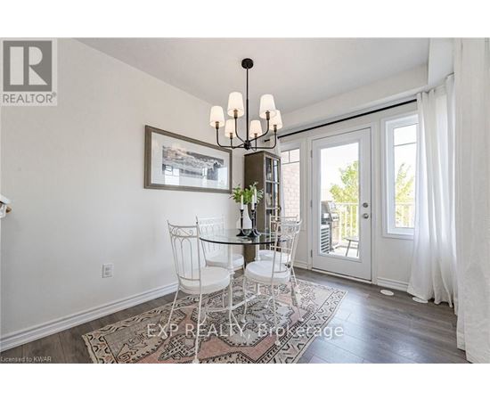 A dining room with a glass table and chairs.
